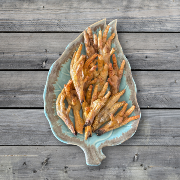 Close-up of crispy chicken claws, showcasing their golden-brown, crunchy texture, perfect for dogs and cats